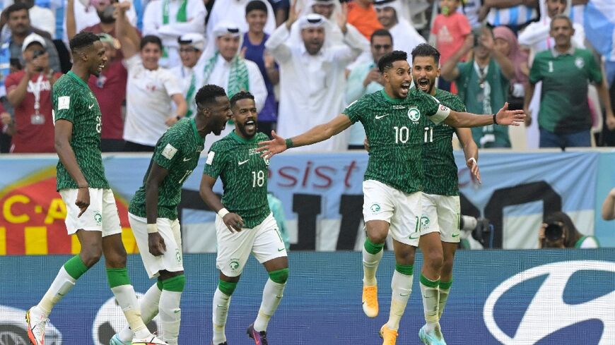 Salem Al-Dawsari (R) gave Saudi Arabia a famous win against eventual champions Argentina at last year's World Cup in Qatar