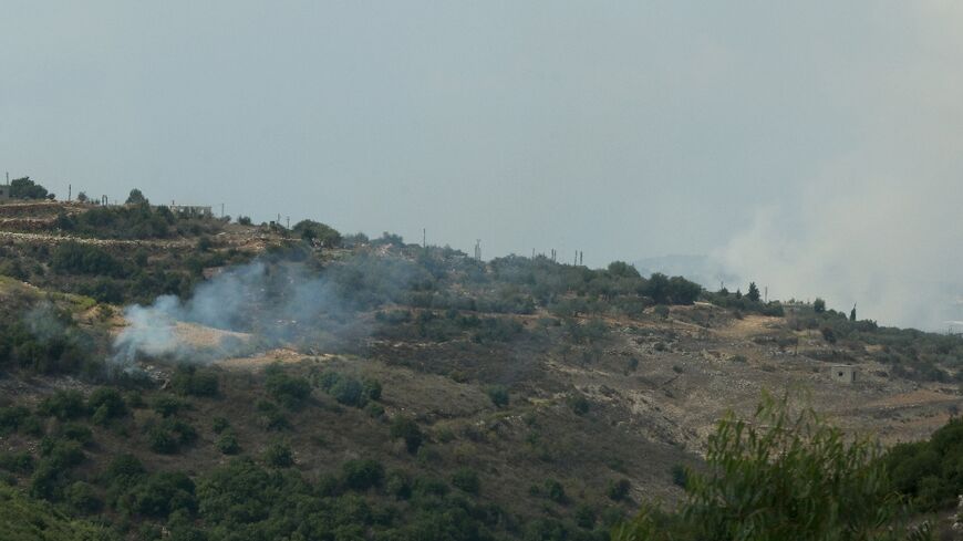 Smoke rises from a hillside in southern Lebanon as it is shelled by Israeli forces following cross-border missile fire by Hezbollah