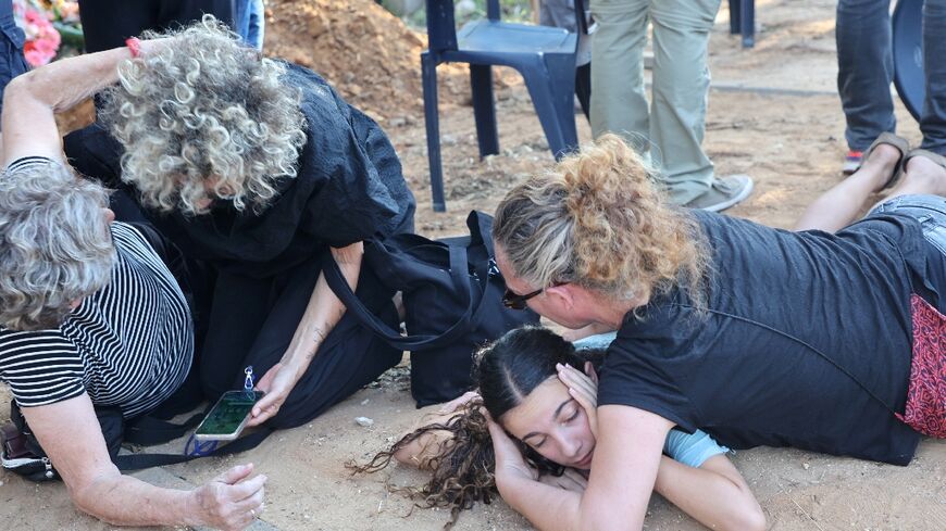 Israeli mourners had to take cover during a funeral after sirens sounded warning of a rocket strike