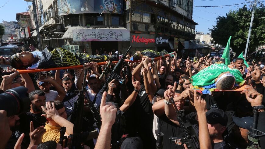 The funeral procession of three Palestinians killed by Israeli fire in the latest violence in the occupied West Bank, at the Jenin refugee camp on October 25, 2023