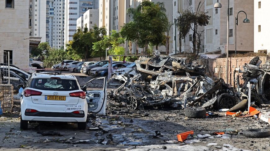 Burnt out vehicles in Ashkelon are pictured following a rocket attack from the Gaza Strip