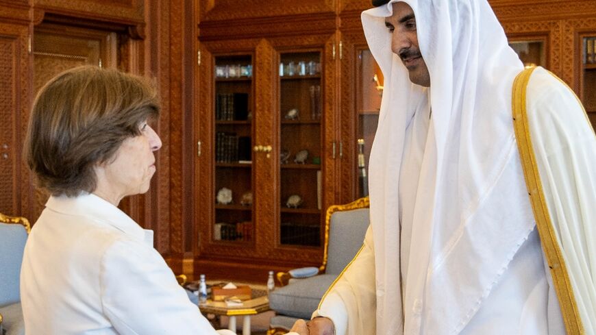 Emir Sheikh Tamim bin Hamad al-Thani welcomes French Foreign Minister Catherine Colonna at the Royal Palace in Doha