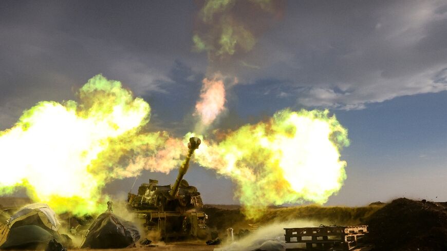 An Israeli artillery unit fires during a military drill in the annexed Golan Heights near the border with Lebanon