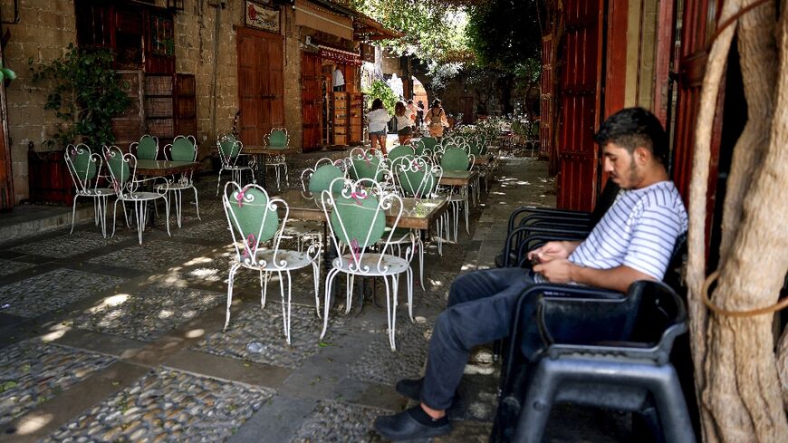 Waiting for customers at an empty restaurant in Lebanon's historic city of Byblos