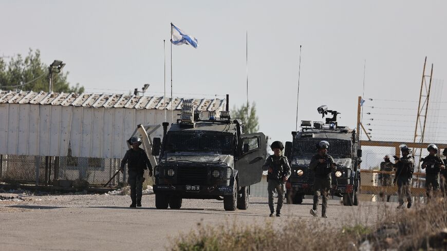 Israeli border police stand guard outside Ofer military camp in the occupied West Bank in preparation for the release of Palestinian prisoners in exchange for Israeli hostages held in Gaza