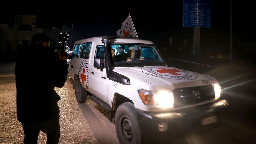 A Red Cross vehicle carrying Israeli hostages leaves Gaza late Thursday in what proved to be the last such release in a week-long truce