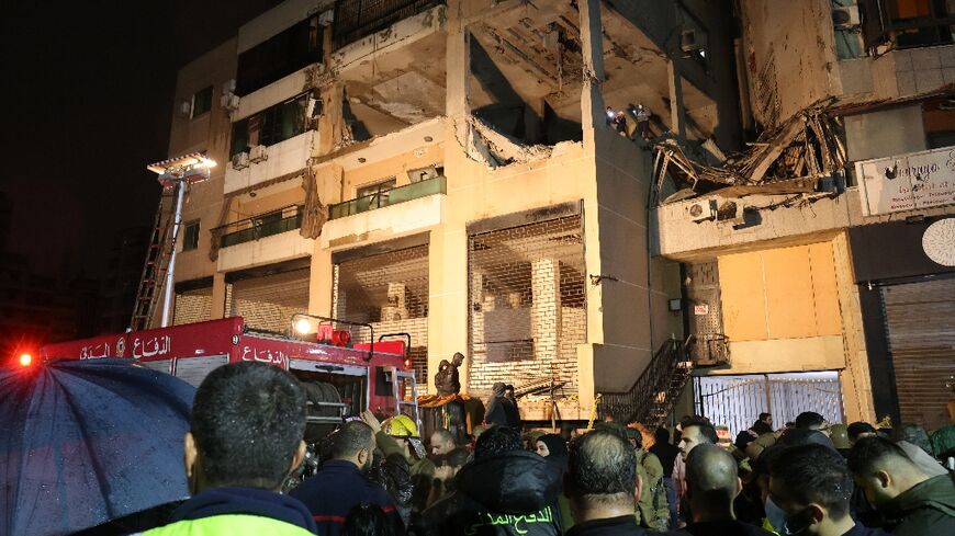Lebanese emergency responders gather at the site of a strike attributed to Israel that killed a Hamas deputy