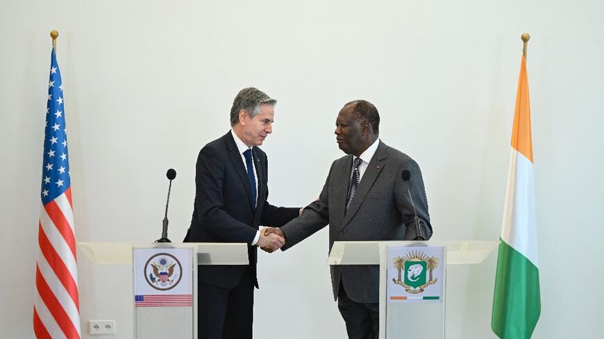 US Secretary of State Antony Blinken (L) met Ivorian President Alassane Ouattara (R) on the latest leg of a tour of African nations