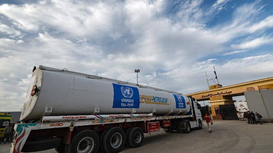A truck from the United Nations agency for Palestinian refugees (UNRWA) carrying fuel arrives at the Egyptian side of the Rafah border crossing with Gaza on November 22, 2023, during fighting between Israel and Hamas militants