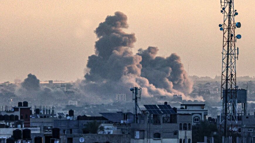 Smoke billowing over Khan Yunis in the southern Gaza Strip, ravaged by 100 days of war