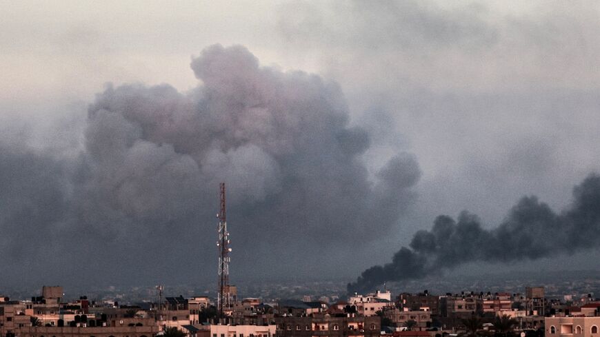 Smoke billows over Khan Yunis in the southern Gaza Strip on Tuesday