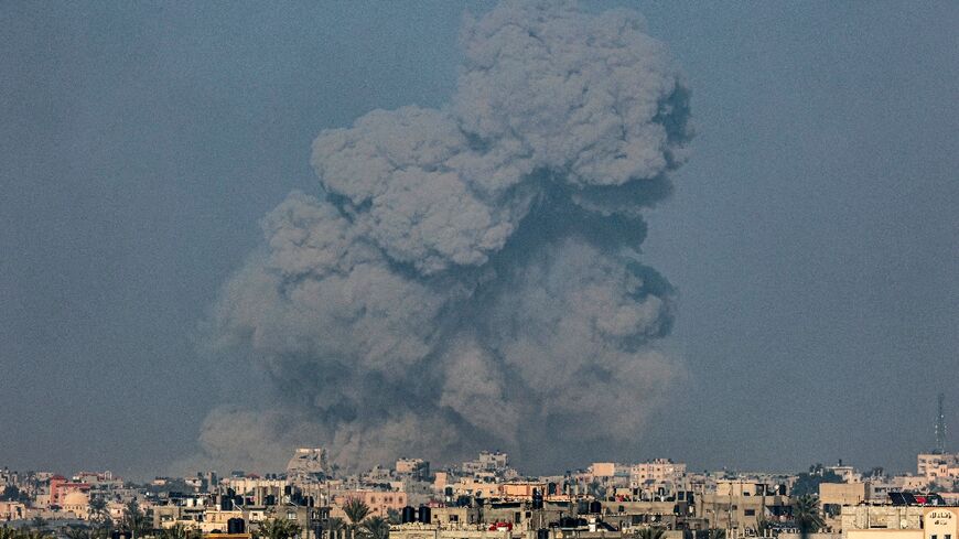 An AFP journalist saw plumes of dark smoke towering above Khan Yunis