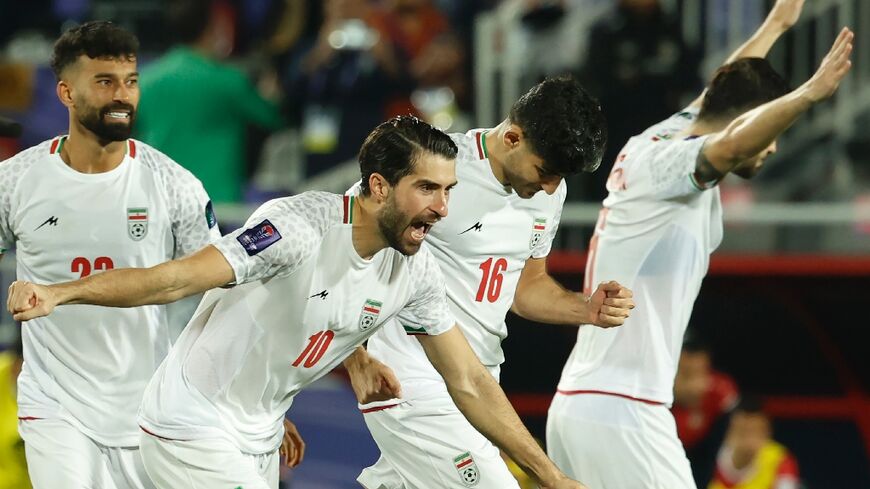 Iran's players celebrate their win on penalties