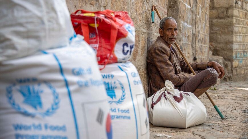 Displaced civilians in the Yemeni city of Taez receive humanitarian aid provided by the World Food Programme (WFP)