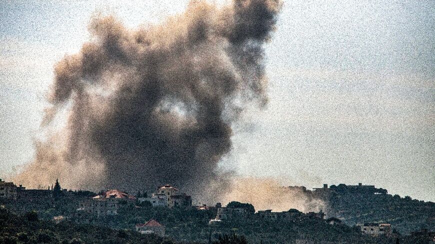 Smoke billows over the south Lebanon village of Kfarkila following an Israeli bombardment in the latest exchange of fire across the border