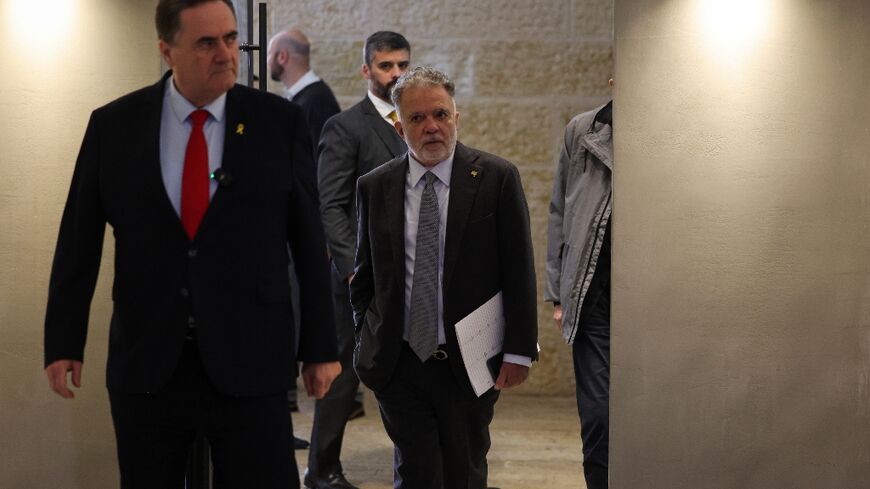 Brazil's ambassador to Israel Frederico Meyer (C) visits the Yad Vashem Holocaust Memorial museum in Jerusalem, where he was summoned by Israel's Foreign Minister Israel Katz (L)
