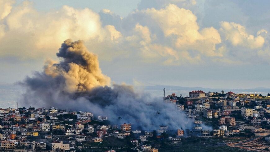 Smoke billows over the south Lebanon town of Al-Khiam following a reported Israeli air strike