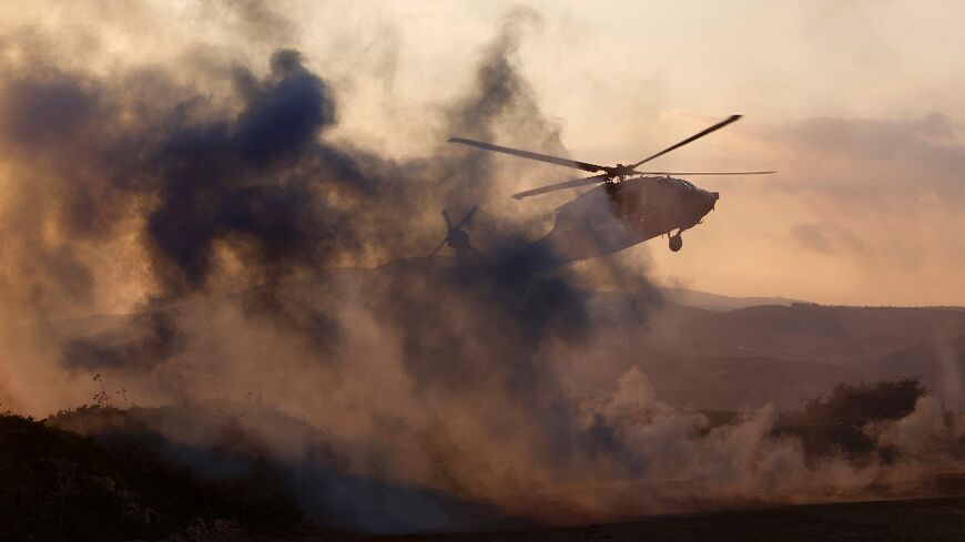 An Israeli helicopter takes off during a military exercise in Upper Galilee near the Lebanon border on February 7, 2024