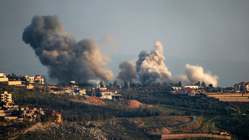 Smoke billows over the south Lebanon border village of Khiam where Israeli strikes have killed a civilian