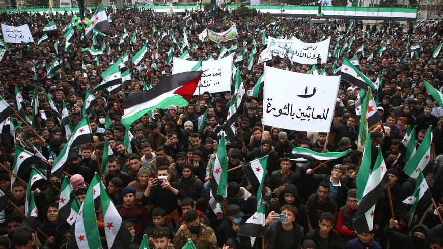 Syrians protested in Idlib to mark 13 years since a pro-democracy uprising that was crushed, leading to civil war