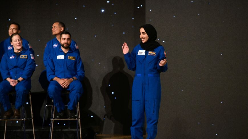 Nora Al Matrooshi (R) waves during the graduation ceremony for NASA Artemis astronaut candidates at Johnson Space Center in Houston, Texas, on March 5, 2024 