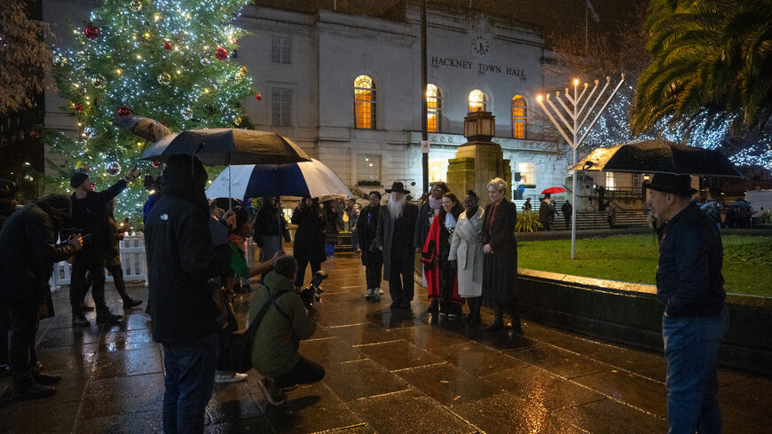 Local dignitaries including Hackney MP Diane Abbott and Rabbi Herschel Gluck pose for a photograph in front of a Menorah that has been lit outside Hackney Town Hall to mark the arrival of Hanukkah on Dec. 7, 2023 in London, England. 