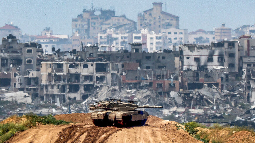 This picture taken from Israel's southern border with the Gaza Strip shows Israeli army battle tank at a position along the border with the Palestinian territory, amid the ongoing conflict between Israel and Hamas, March 19, 2024.