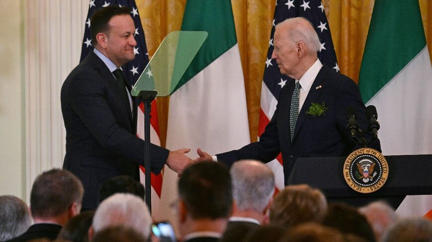 US President Joe Biden (R) shakes hands with Taoiseach of Ireland Leo Varadkar during a St. Patrick’s Day Celebration in the East Room of the White House in Washington, DC, on March 17, 2024