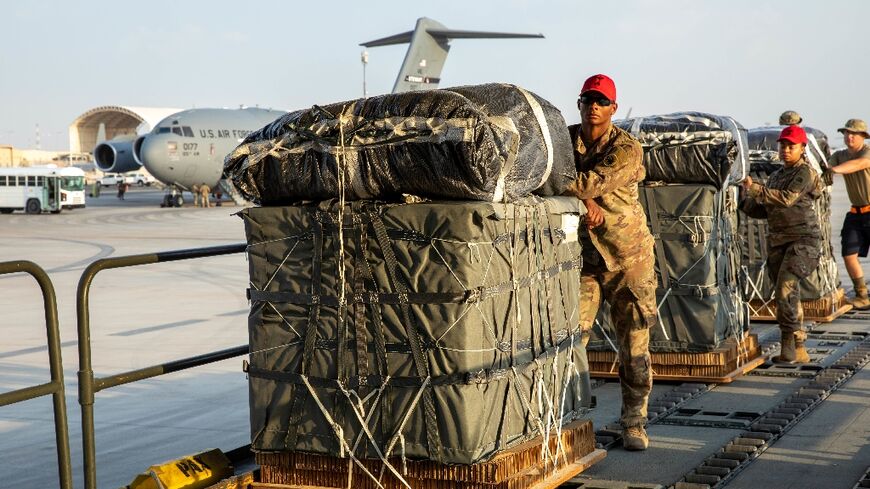 In this image obtained from the US Central Command, military personnel load humanitarian aid into US Air Force C-130 planes on March 5, 2024
