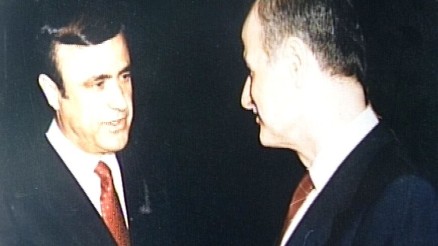 This file photograph taken in 1986 shows then Syrian President Hafez al-Assad (R) with youngest brother Rifaat (L) attending a reception in London   Rifaat al-Assad, the uncle of Syrian president Bashar al-Assad, will stand trial in Switzerland for war crimes and crimes against humanity, the Swiss attorney general said on March 12, 2024.