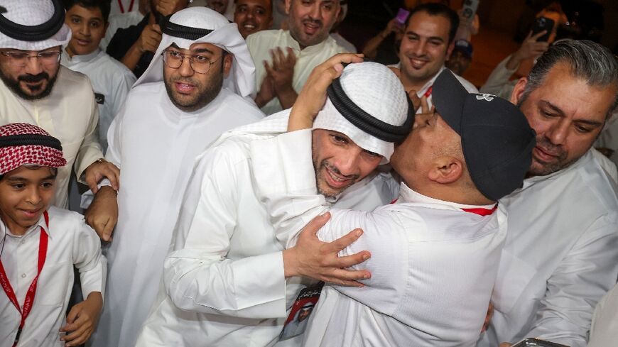 Supporters hail former parliament speaker Marzouq al-Ghanim after his election win