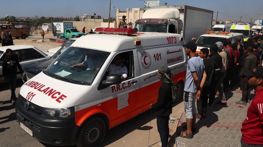Ambulances carrying the bodies of staff members of the US-based aid group World Central Kitchen at Gaza's Rafah crossing with Egypt 