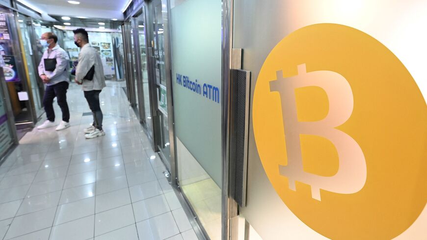 A logo of the digital currency Bitcoin is pictured on an ATM in a mall in Hong Kong on November 1, 2022. - In contrast to mainland China where crypto has been all but banned, Hong Kong is looking to relax regulations and claw back some of the business that has left and is exploring whether to legalise crypto trading by retail investors. (Photo by Peter PARKS / AFP) (Photo by PETER PARKS/AFP via Getty Images)