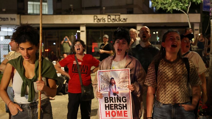 Demonstrators carry a poster of Hersh Goldberg-Polin at a rally in Jerusalem urging action to rescue hostages remaining in Gaza