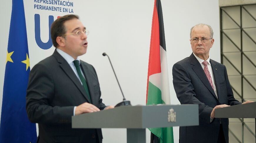 Spanish Foreign Minister Jose Manuel Albares (L) and Palestinian Prime Minister Mohammad Mustafa spoke side-by-side in Brussels 