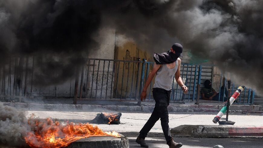 Protesters set fire to tyres in downtown Jenin