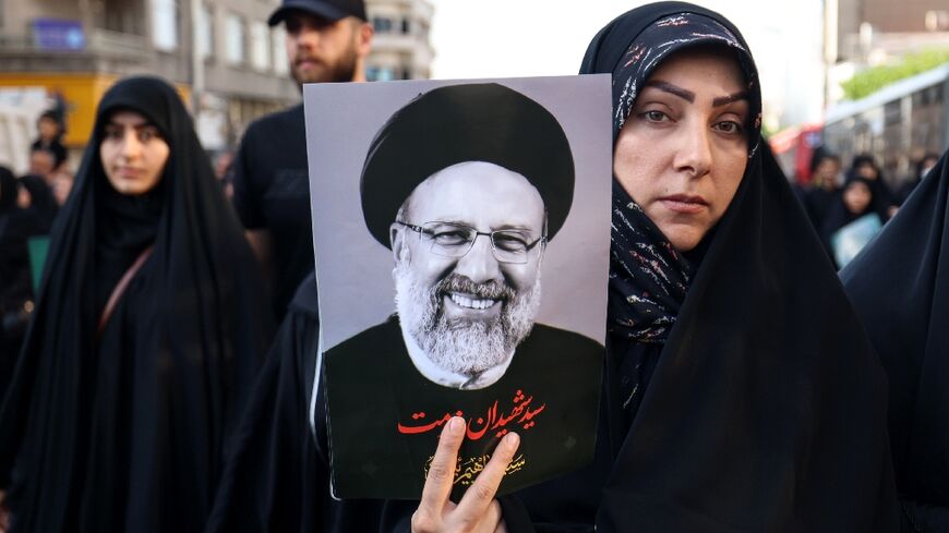 Iranians pay their last respects to president Ebrahim Raisi and seven members of  his entourage killed in a Sunday helicopter crash