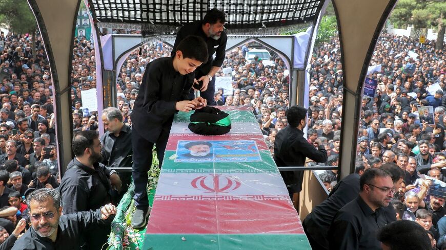 The coffin of late Iranian president Ebrahim Raisi is seen during a funeral procession in the eastern city of Birjand