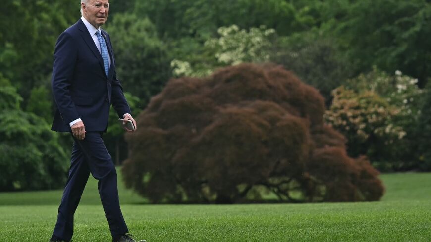 US President Joe Biden walks on the South Lawn of the White House after returning on Marine One, in Washington, DC, on May 6, 2024. Biden is returning from Wilmington where he spent the weekend.