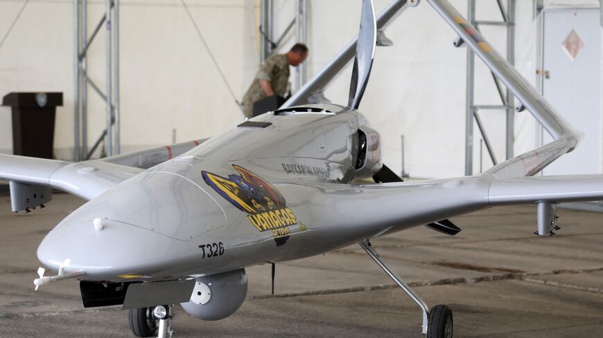 A Turkish Bayraktar TB2 combat drone is on view during a presentation at the Lithuanian Air Force Base in Siauliai, Lithuania, on July 6, 2022. 
