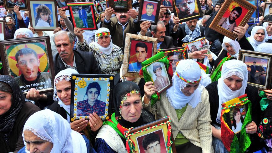 Kurdish women hold portraits of their missing sons on May 18, 2011, during a demonstration in Istanbul against the recent killing of 12 Kurdish rebels by security forces.