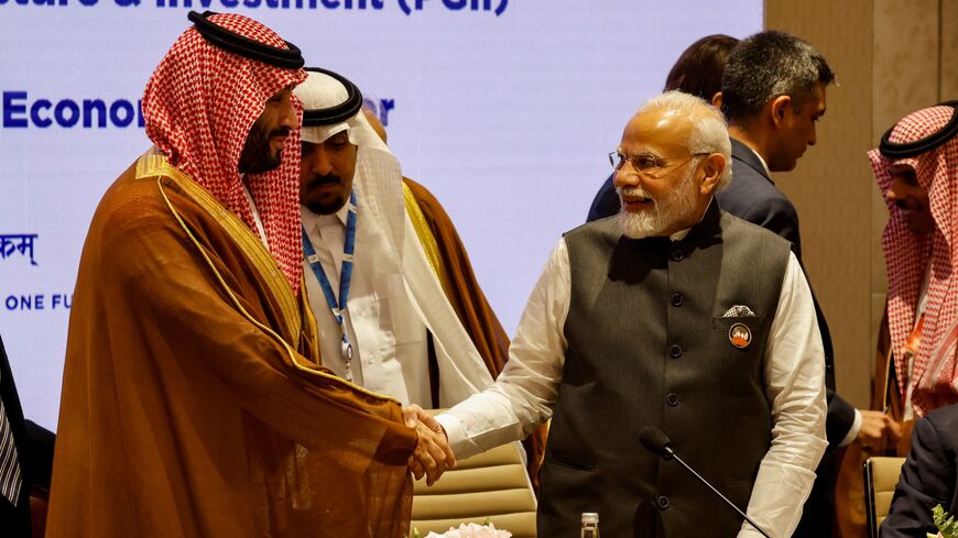 India's prime minister, Narendra Modi, and his Saudi Arabia counterpart and Crown Prince Mohammed bin Salman (L) shake hands during a session of the G20 Leaders' Summit at the Bharat Mandapam in New Delhi on Sept. 9, 2023.