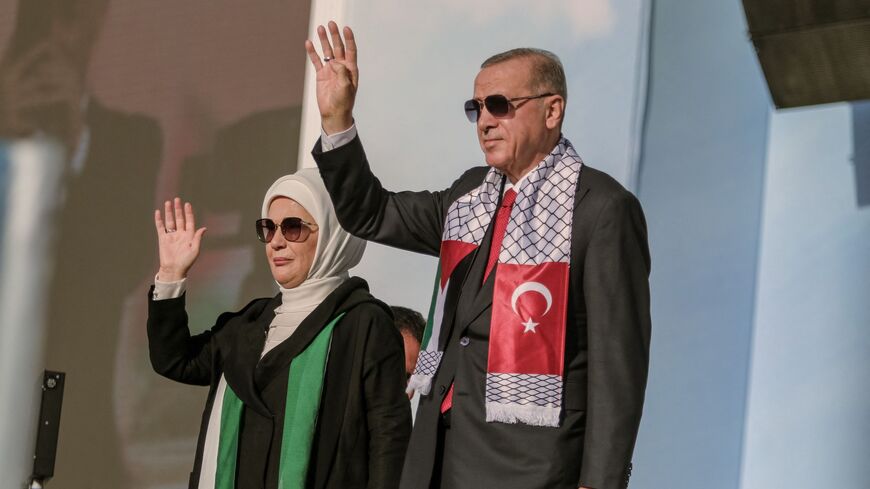 Turkish President, Recep Tayyip Erdogan, and his wife, Emine Erdogan, attend a rally in solidarity with Palestinians in Istanbul on October 28, 2023. 