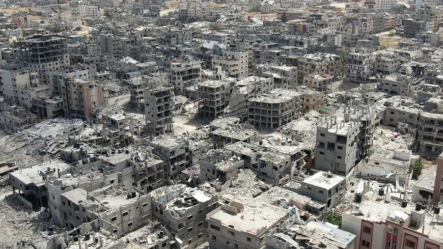 TOPSHOT - This video grab from AFPTV shows an aerial view of destroyed buildings in Khan Yunis in the southern Gaza Strip on April 22, 2024 amid the ongoing conflict in the Palestinian territory between Israel and them militant group Hamas. Israel pulled its ground forces from Khan Yunis on April 7 after carrying out what it called a "precise and limited operation" at the Nasser Medical Complex, one of the biggest hospitals in the Palestinian territory. (Photo by AFPTV / AFP) (Photo by -/AFPTV/AFP via Getty