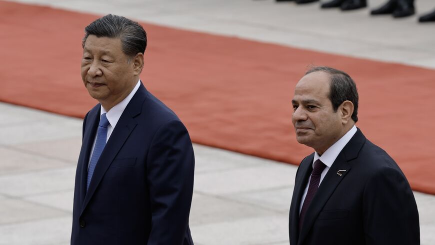 Chinese President Xi Jinping (L) walks next to Egyptian President Abdel Fattah al-Sisi as they review the honour guard during a welcome ceremony for Egyptian President Abdel Fattah al-Sisi at the Great Hall of the People on May 29, 2024, in Beijing, China.
