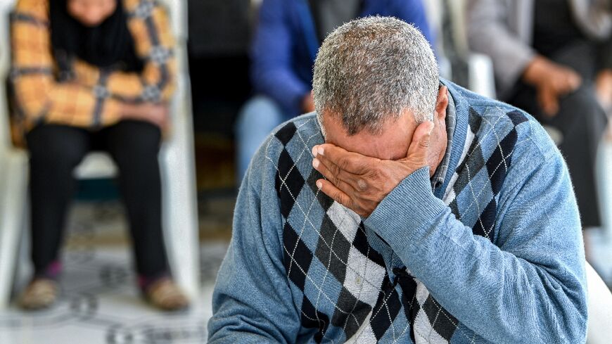 A family member of one of the Tunisian migrants who were lost at sea in January struggles to contain his emotions