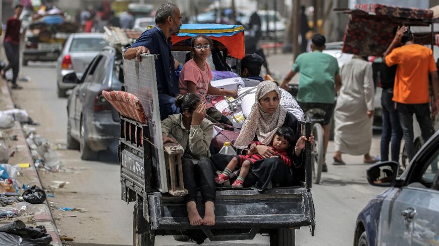 Displaced Palestinians flee southern Gaza's Rafah city after more than seven months of war