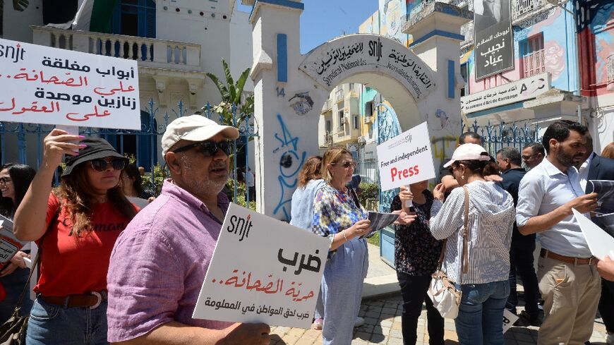 Tunisian journalists protesting outside their union headquarters