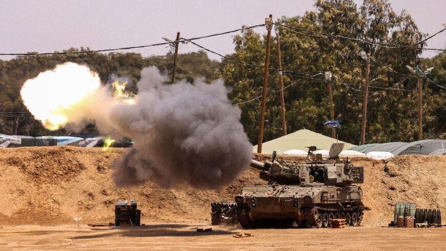 An Israeli mobile artillery unit fires from a border position in southern Israel toward the Gaza Strip on May 13, 2024