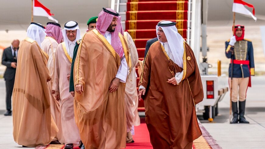 Bahrain's Crown Prince and Prime Minister Salman bin Hamad al-Khalifa greets Saudi Crown Prince Mohammed bin Salman